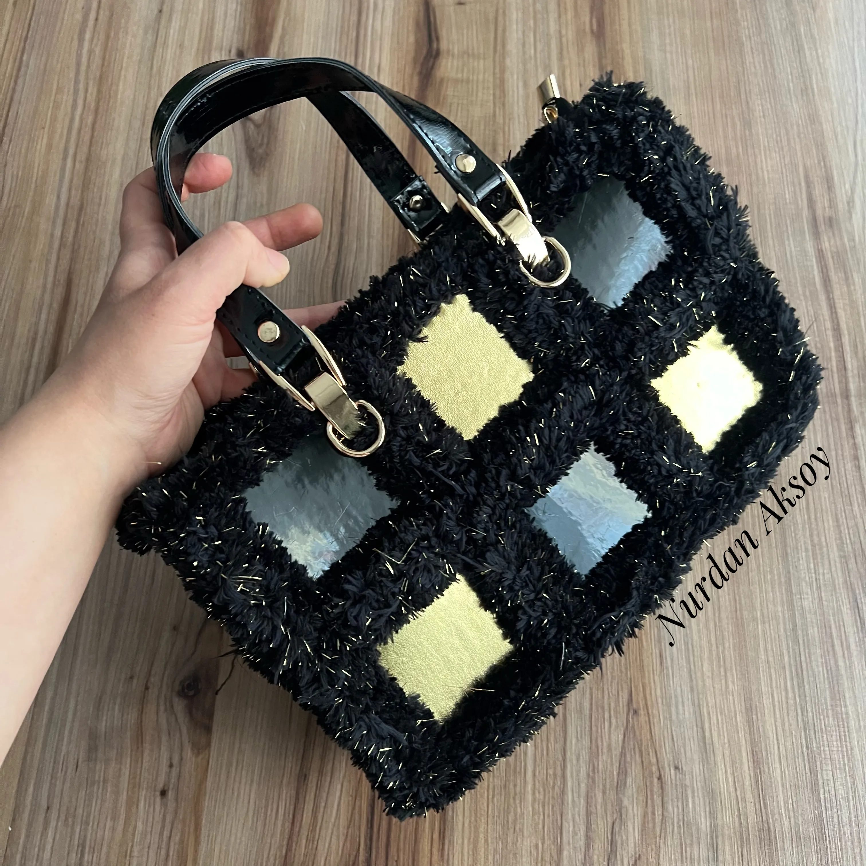 Stylish bag with handmade square leather motifs