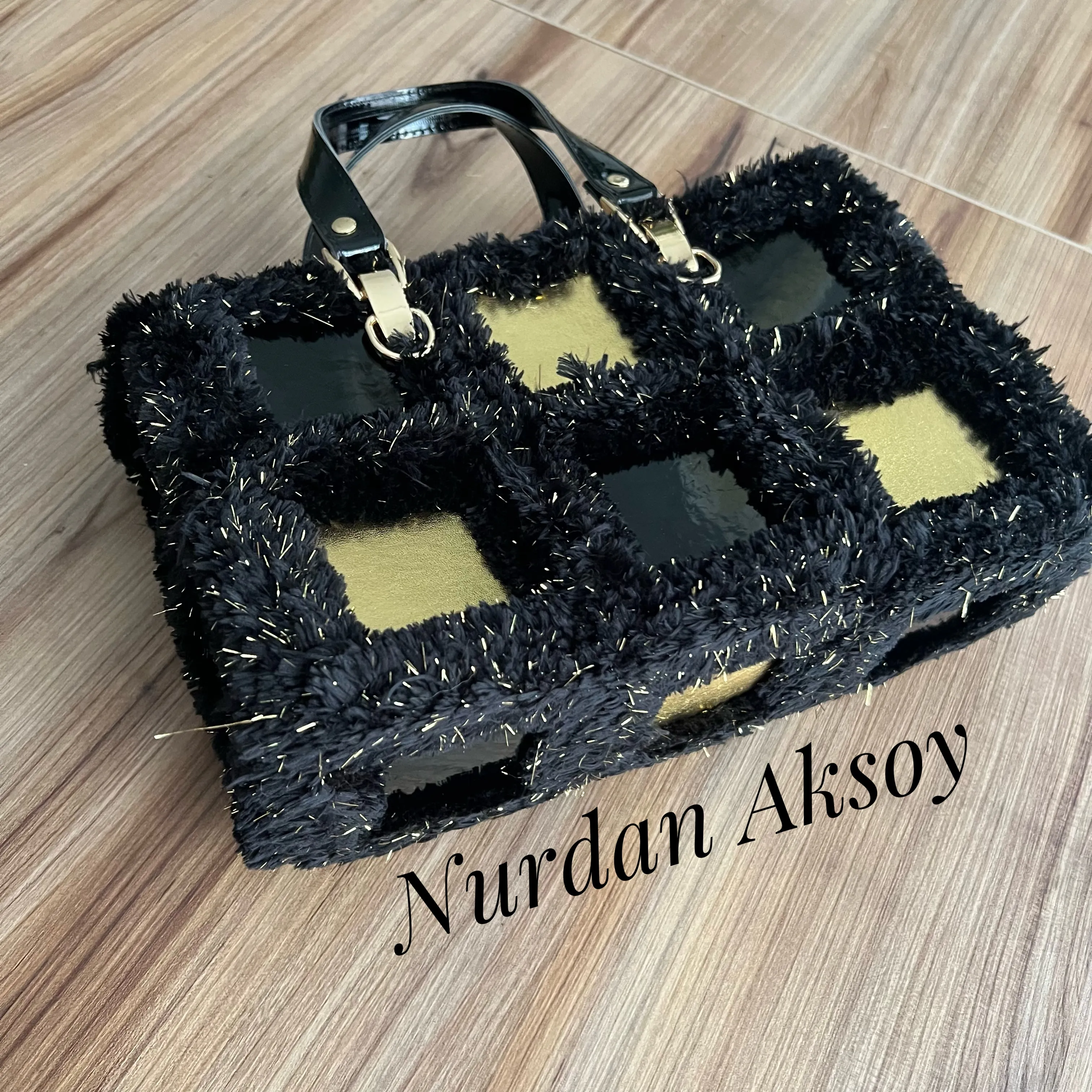 Stylish bag with handmade square leather motifs