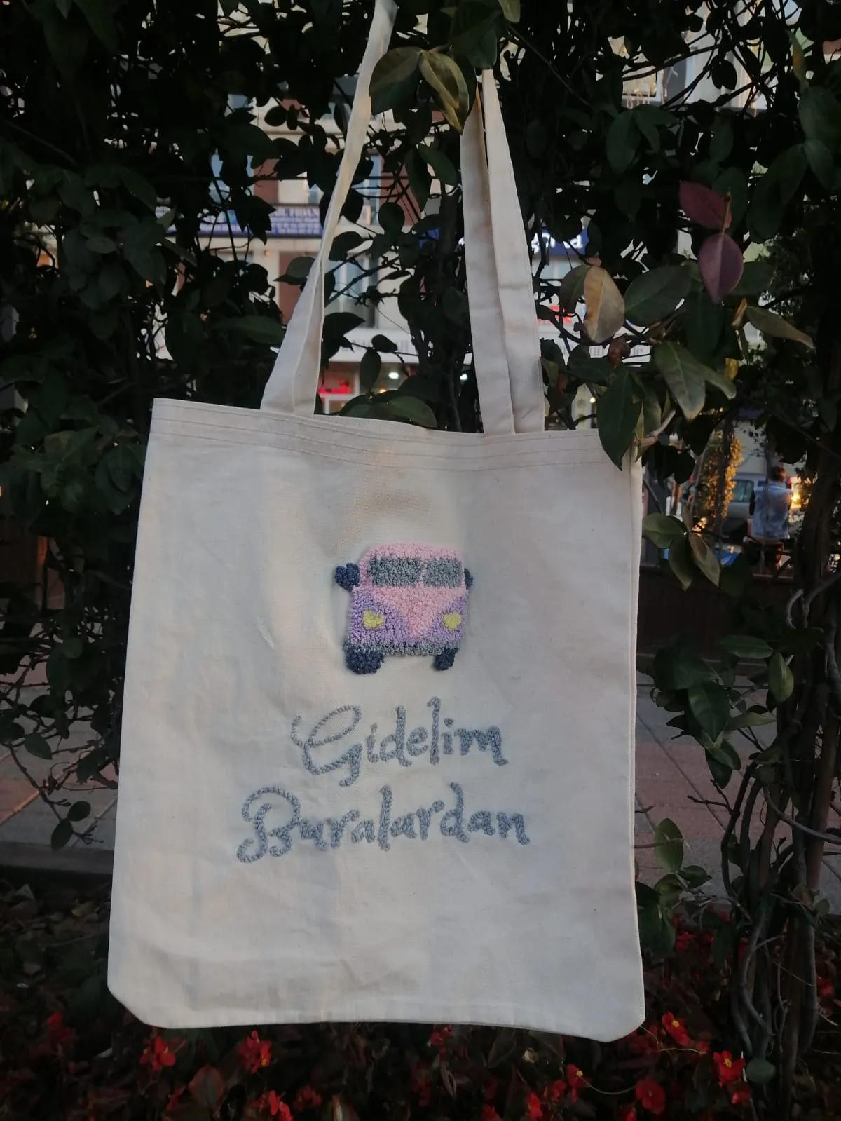 White Cloth Bag with "Let's Get Out of Here" Written