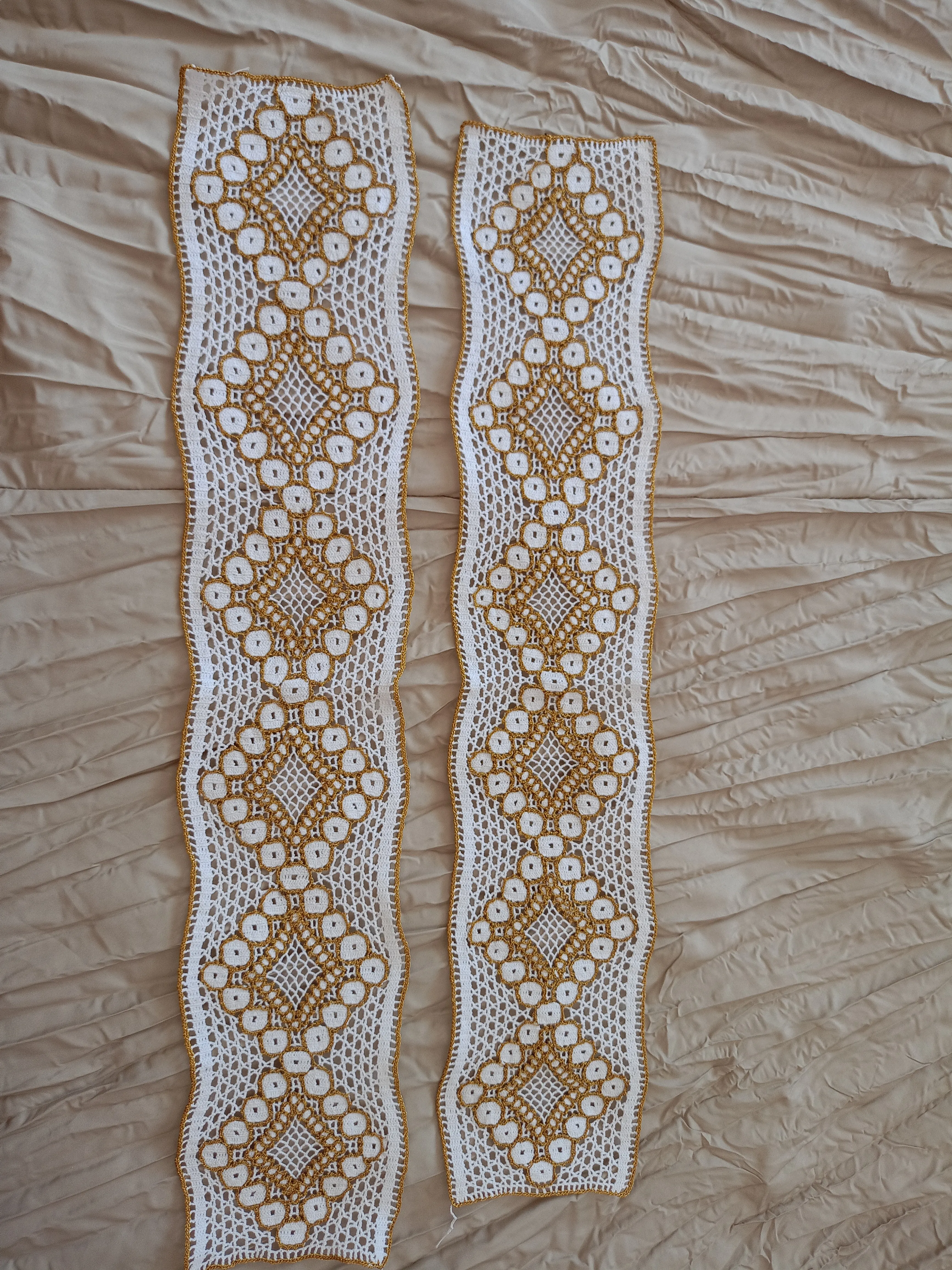 Hand-knitted lace embroidery on the edge of the towel