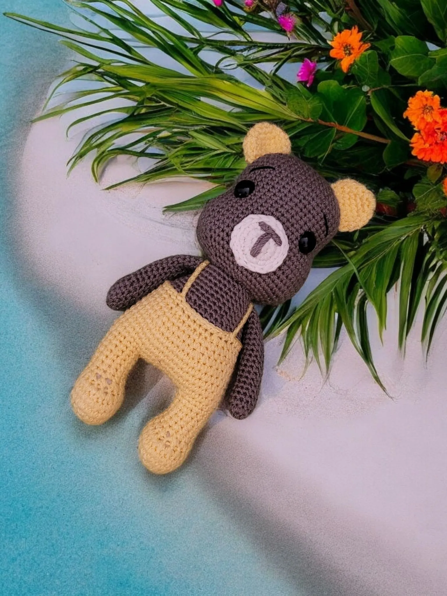 Teddy bear in yellow overalls