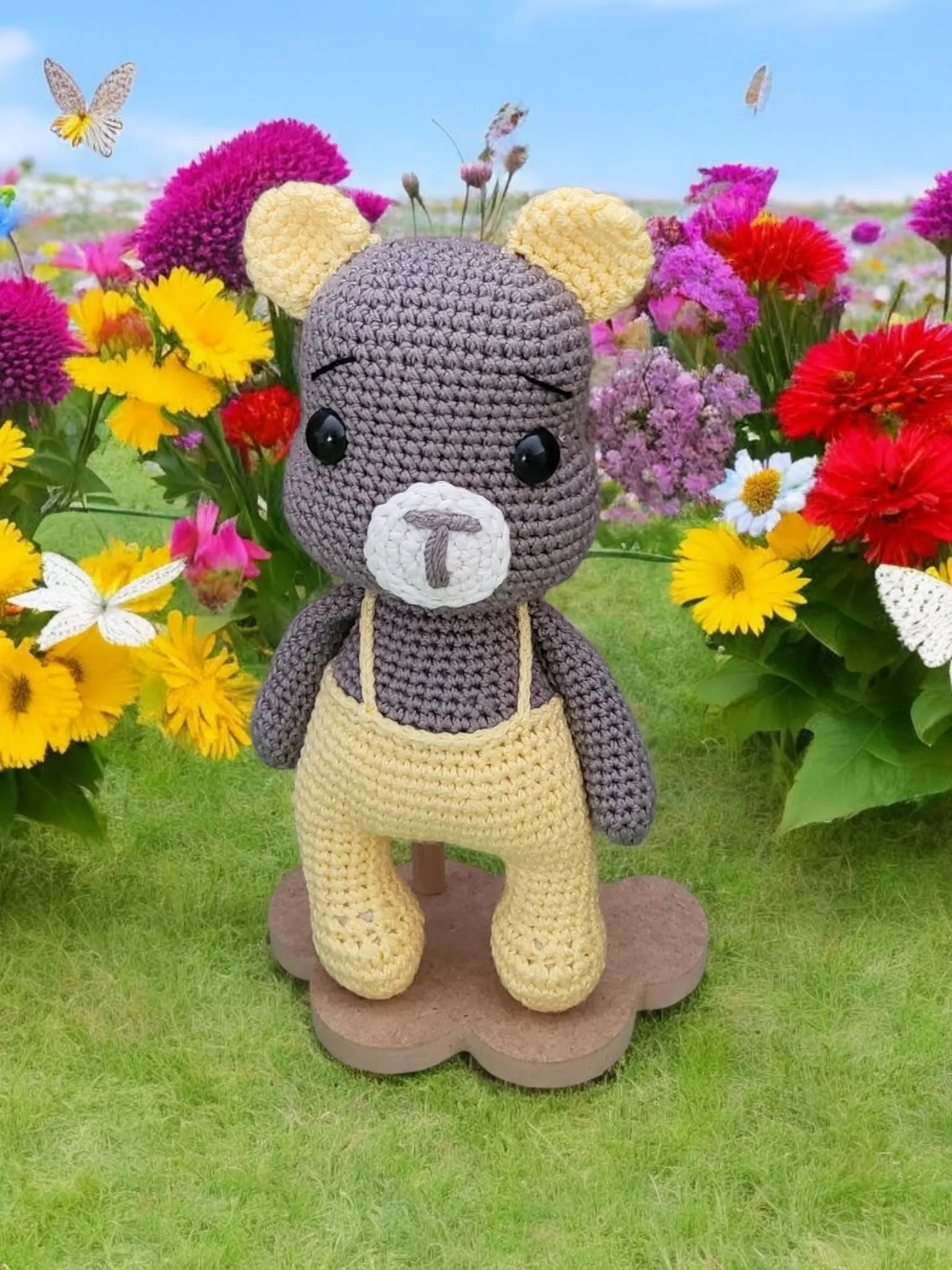 Teddy bear in yellow overalls