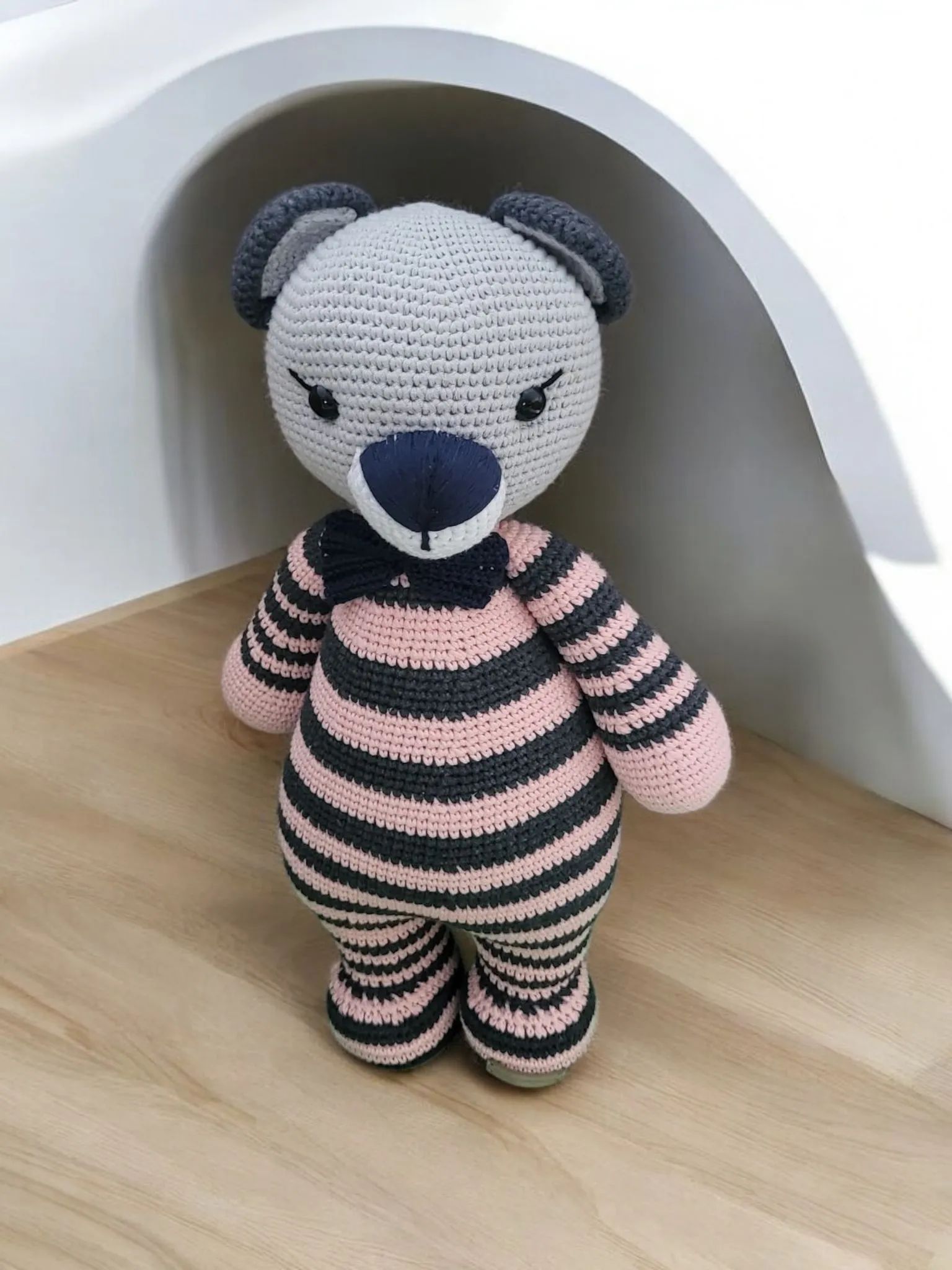 Giant bear in purple pajamas