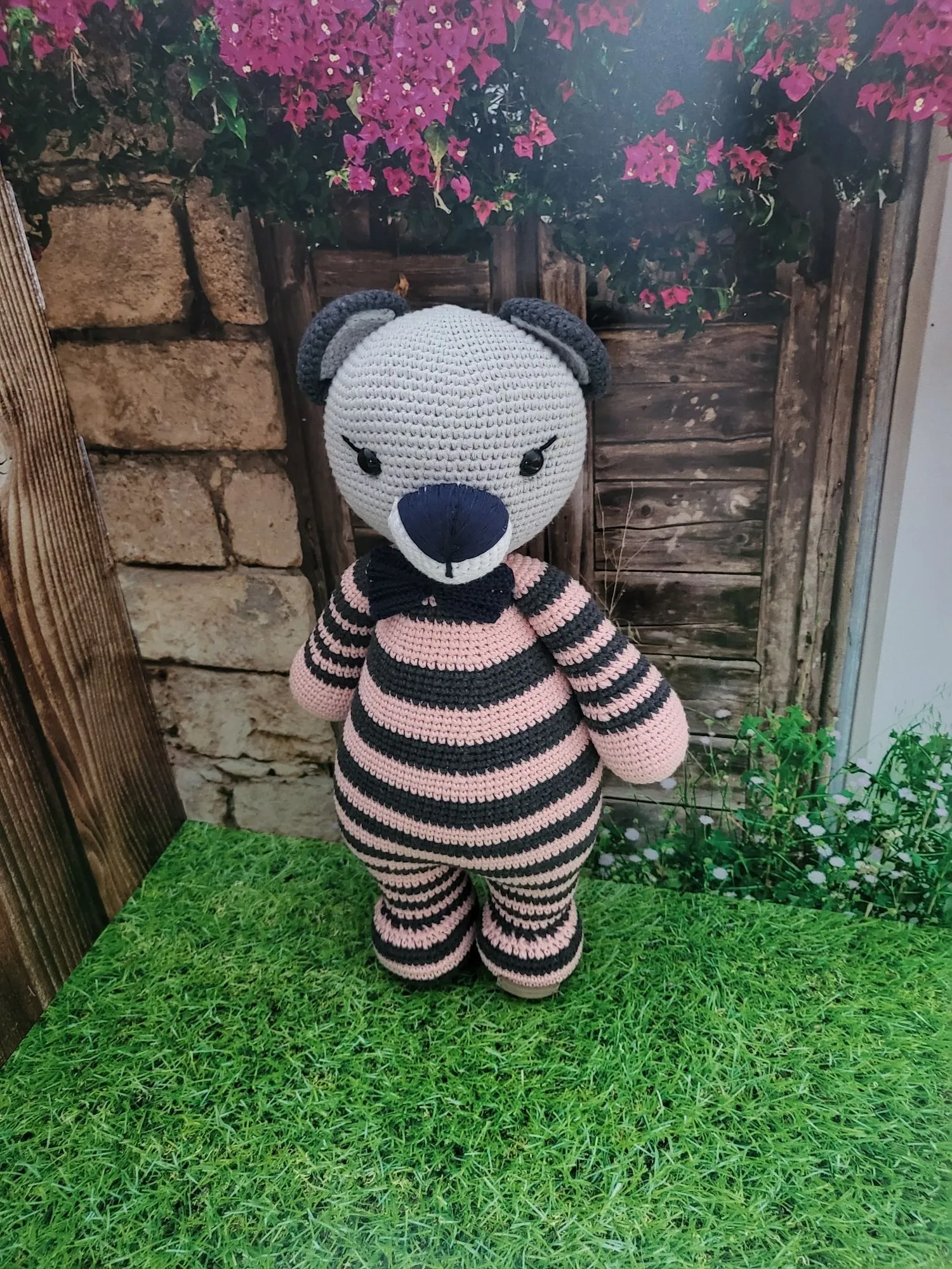 Giant bear in purple pajamas