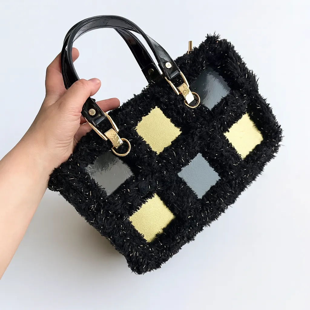 Stylish bag with handmade square leather motifs