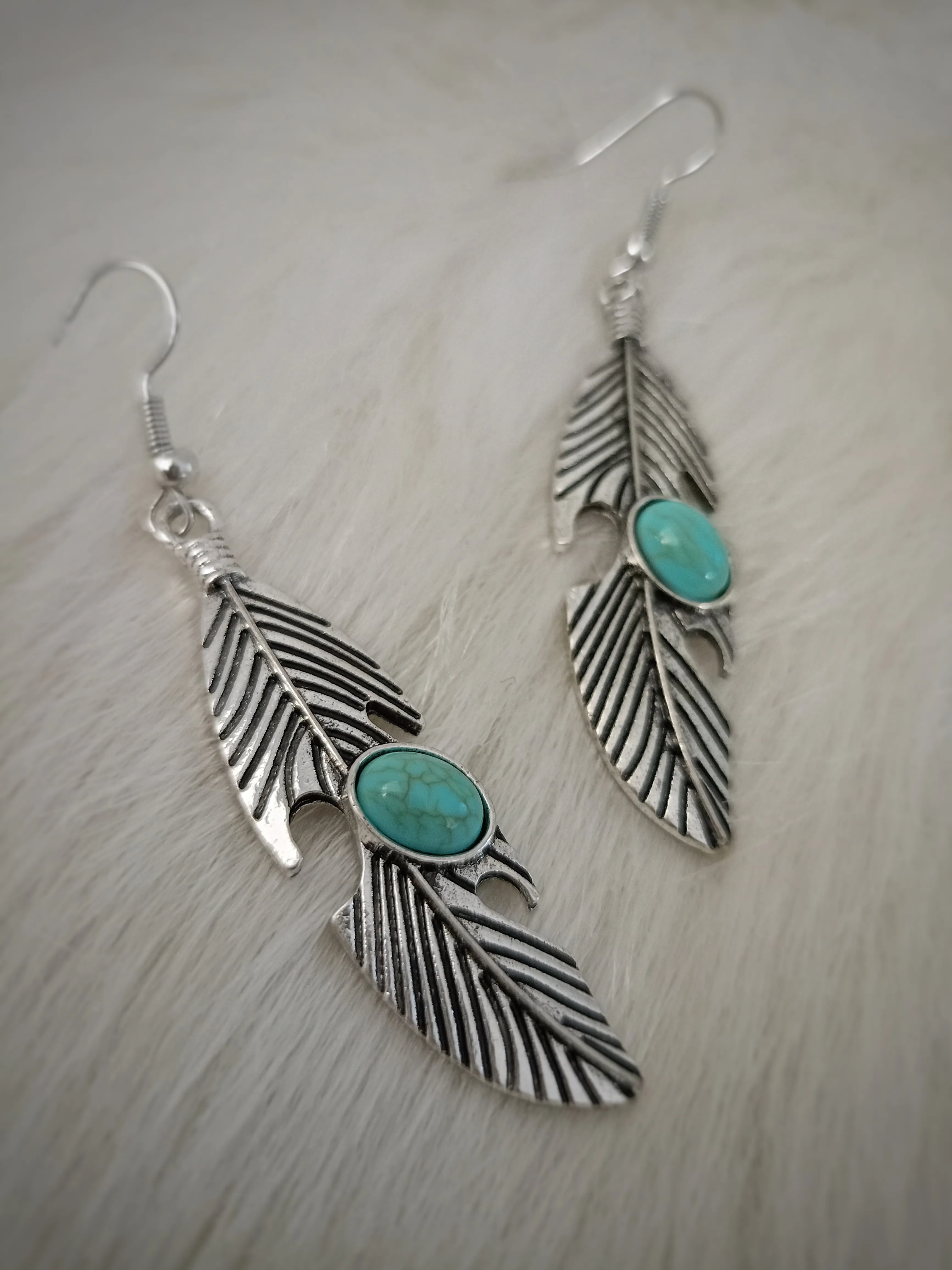 Nature's Elegance: Turquoise Feather Earrings