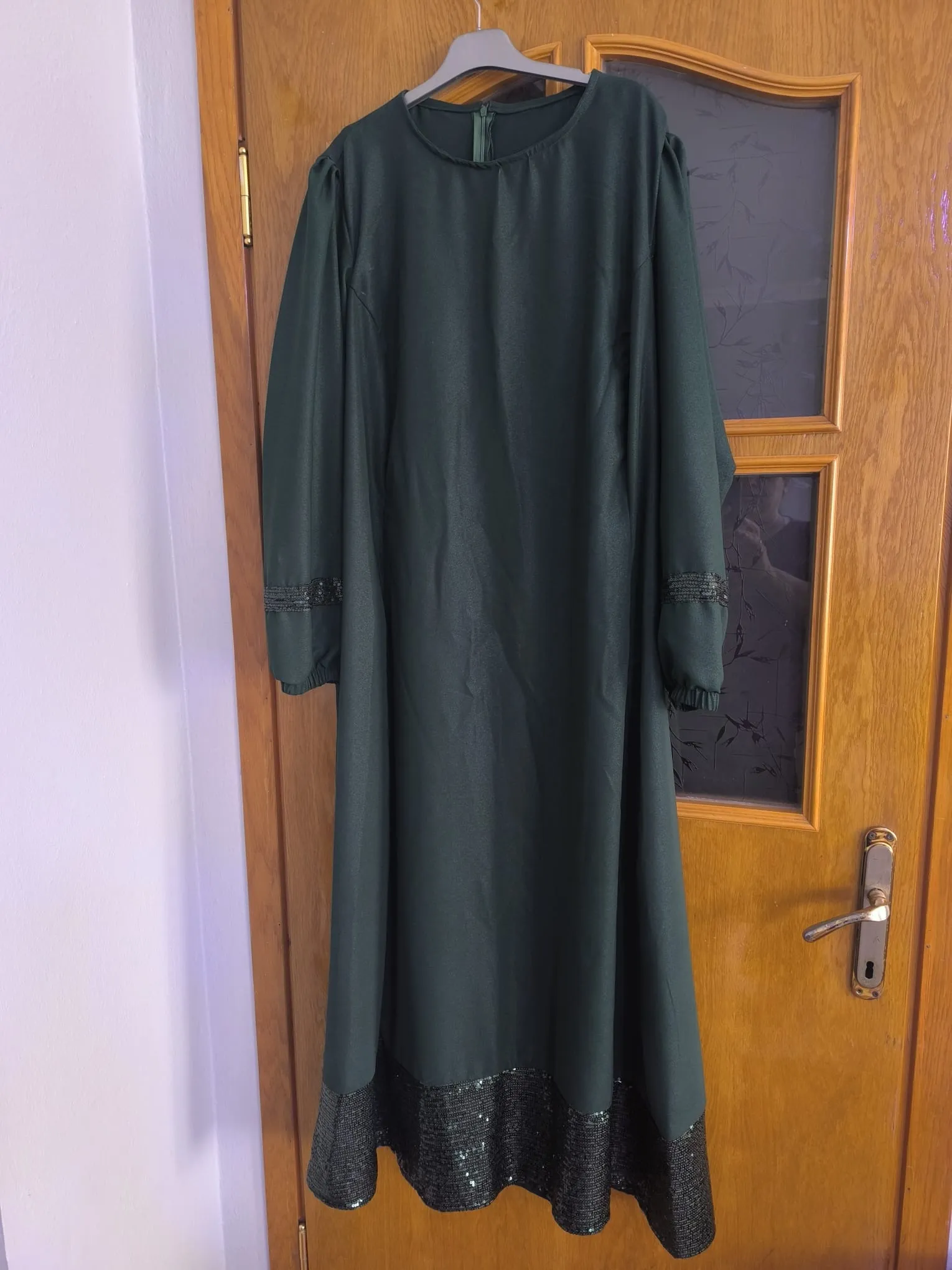 Handmade dress made from green crepe yarn.
