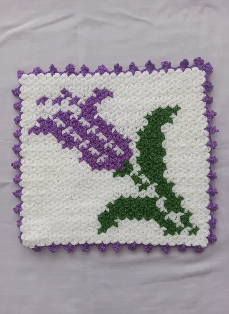 Purple Flowered Hand Knitted Square Bath Loofah - White Background with Green Leaf Detail