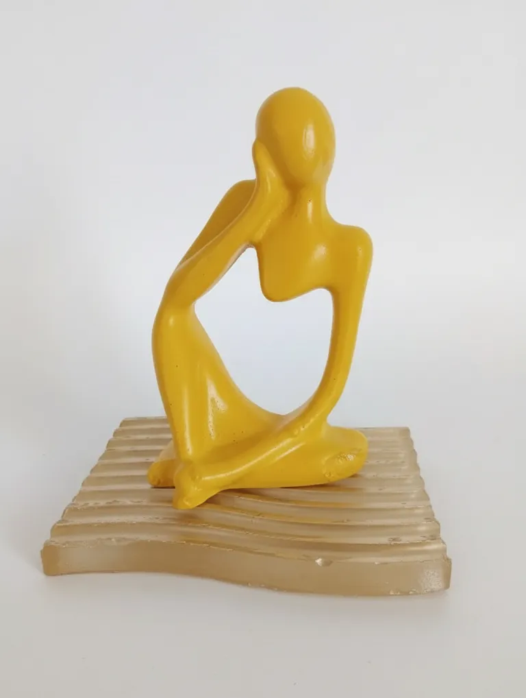 Yellow Color Human Decorative Figurine